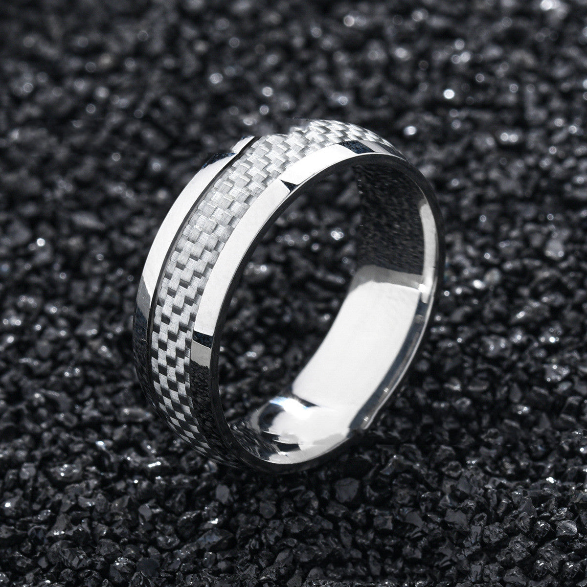 Titanium ring with drop in carbon fiber inlay